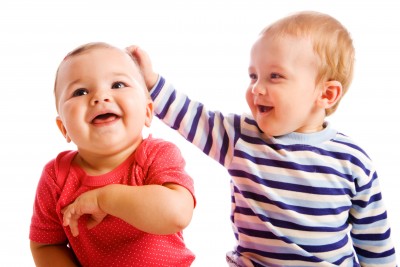 two babies playing