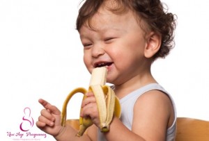 baby eating banana