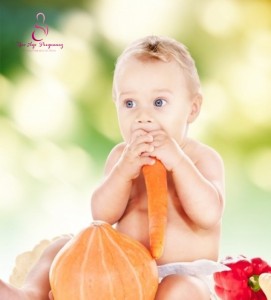 baby eating carrot