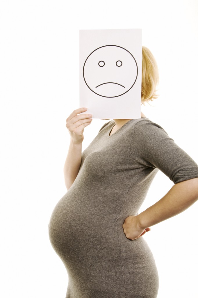 unhappy pregnant woman