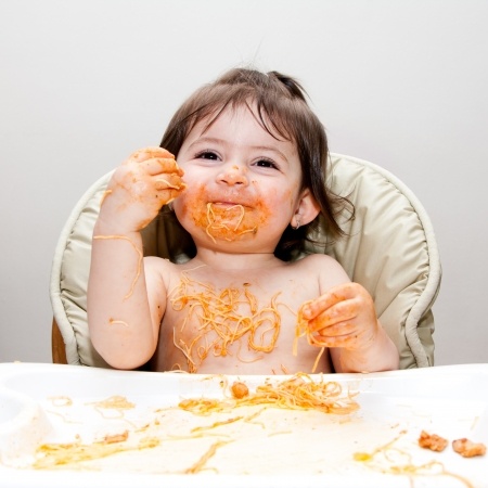 children learn how to feed themselves