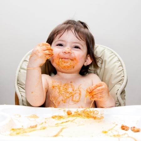 children learn how to feed themselves